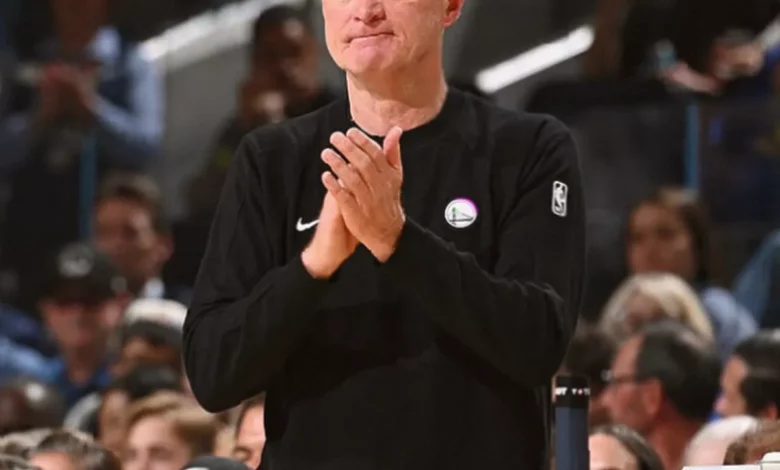 Basketball coach speaking in a press conference setting