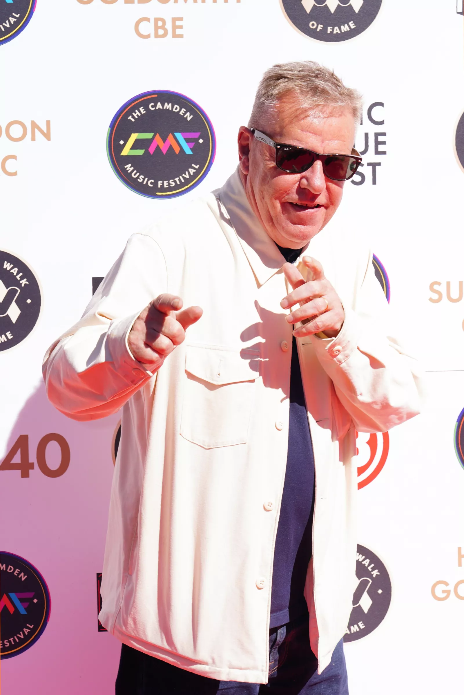 Suggs from Madness sings at vigil for stabbed student