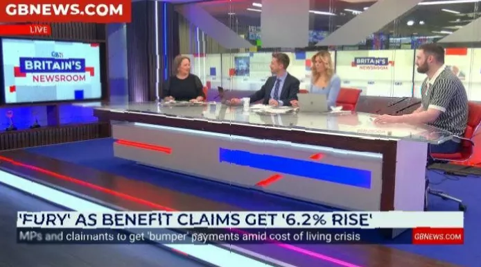 A crowded DWP jobcentre waiting room with claimants seated