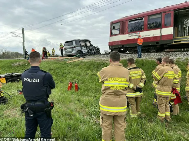 Emergency services at the scene of a serious road and rail collision.