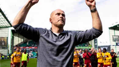 Motherwell manager walking off the pitch at Fir Park after a match