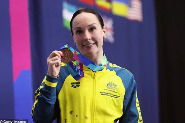 Australian Paralympic team swimming event with competitors in the water
