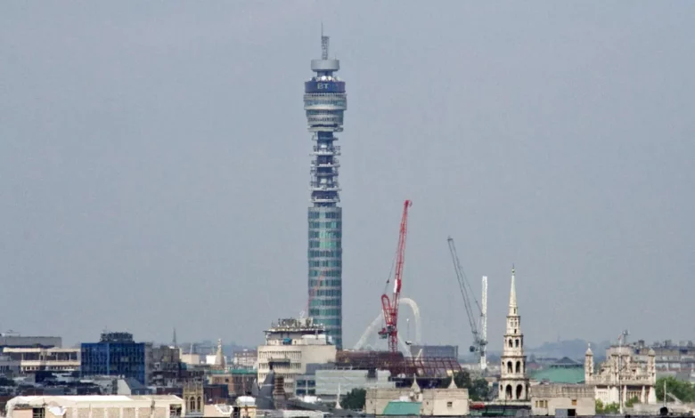 BT Tower in Fitzrovia, London, seen from street level against a blue sky