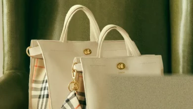 Cotswolds handbag on display with Burberry check pattern