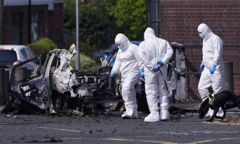 Police station exterior with cordon tape after a suspected bomb attack in Dunmurry