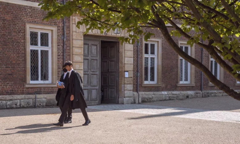 Empty dormitory beds in a historic British boarding school during term time