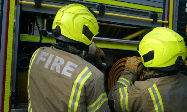 Fire engines and crews on a hillside near Torduff Reservoir tackling a gorse and grass fire.