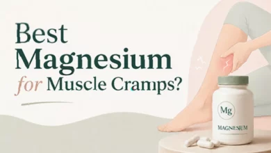 A person sitting in bed at night holding a painful calf muscle.