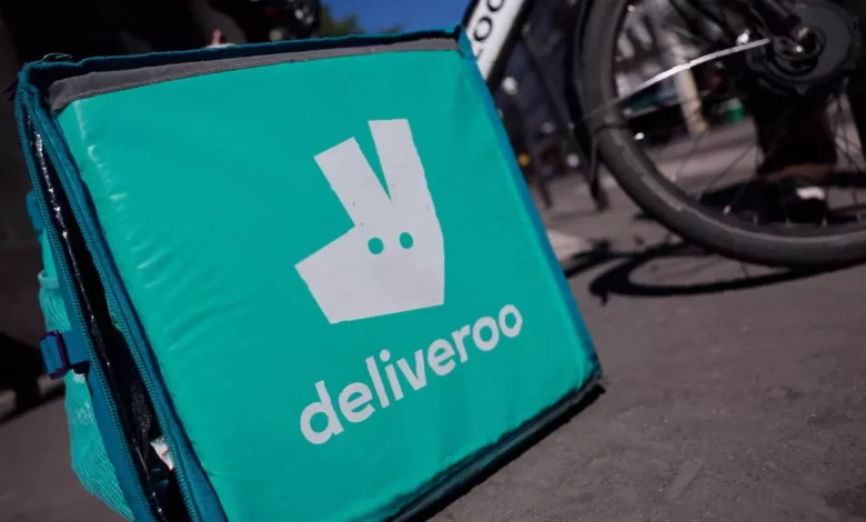 Deliveroo app displays restaurant table booking interface on a smartphone screen