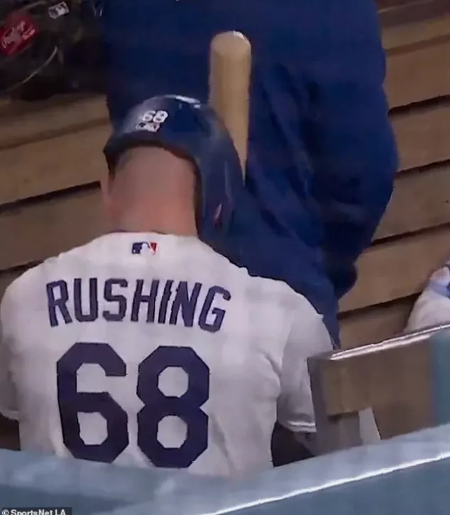 Teammates celebrate on field after late runs secure victory for Dodgers