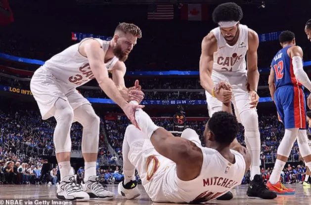 Overtime action as Cleveland Cavaliers guard shoots over Detroit Pistons defender