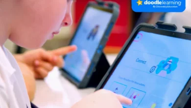Child using a maths app on a tablet in a bright classroom