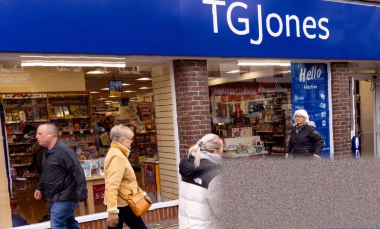 A closed high street storefront with a TG Jones sign and a faded WH Smith logo beneath.