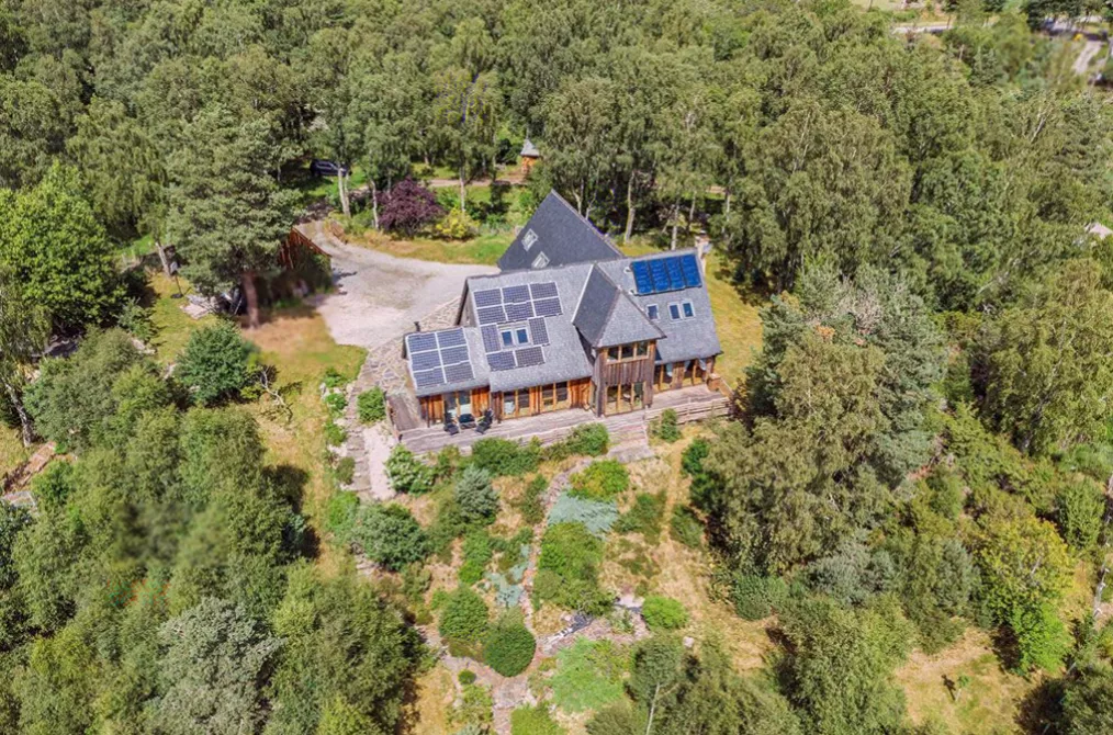 A restored Dartmoor farmhouse with converted barns set in a private valley near Hennock, South Devon.