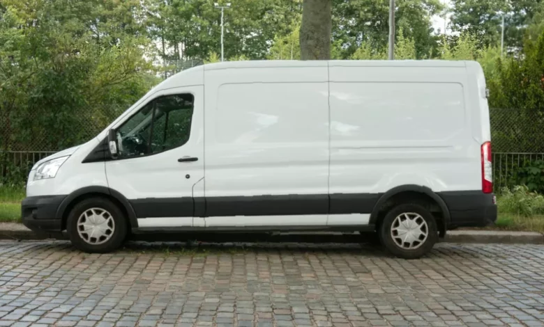 White Ford Transit van stopped outside Braintree train station