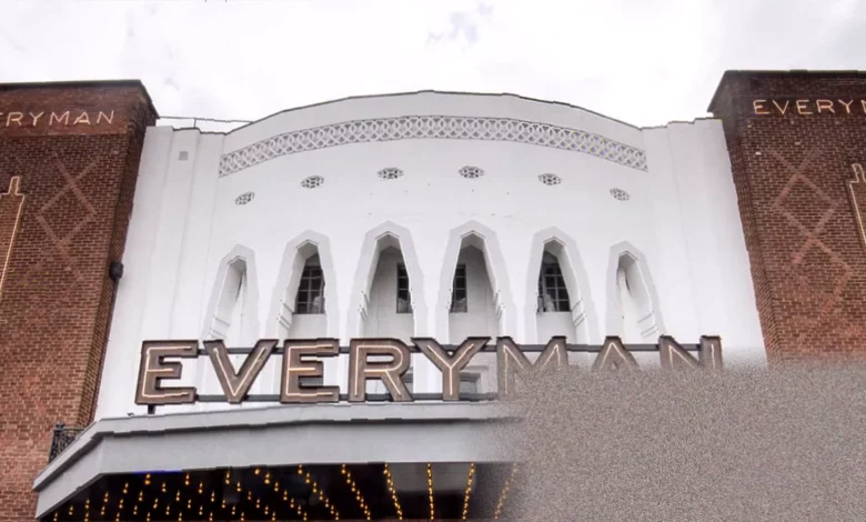 Exterior of an Everyman cinema with its distinctive red signage and historic facade