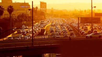 Congested city street with queuing traffic and exhaust fumes in a UK urban centre