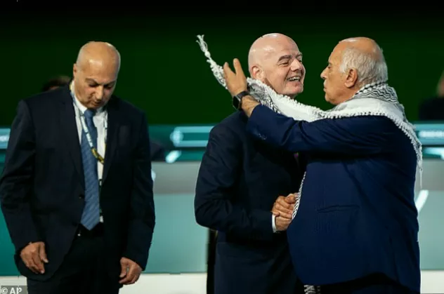 FIFA president Gianni Infantino speaking at a podium while delegates observe the escalating diplomatic incident
