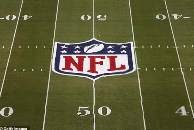Broadcasting control room with multiple screens showing live NFL game feeds