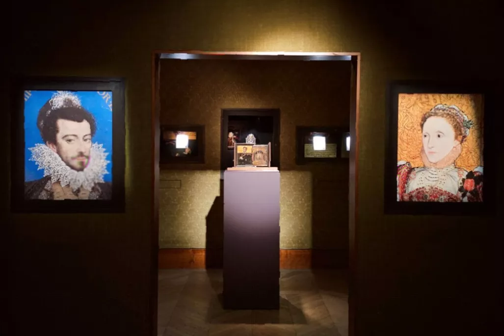 Gallery side room with video screen explaining Tudor portrait symbolism