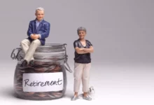 Retiree reviewing pension paperwork at a kitchen table