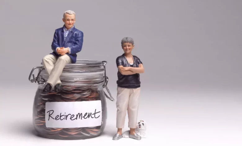 Retiree reviewing pension paperwork at a kitchen table