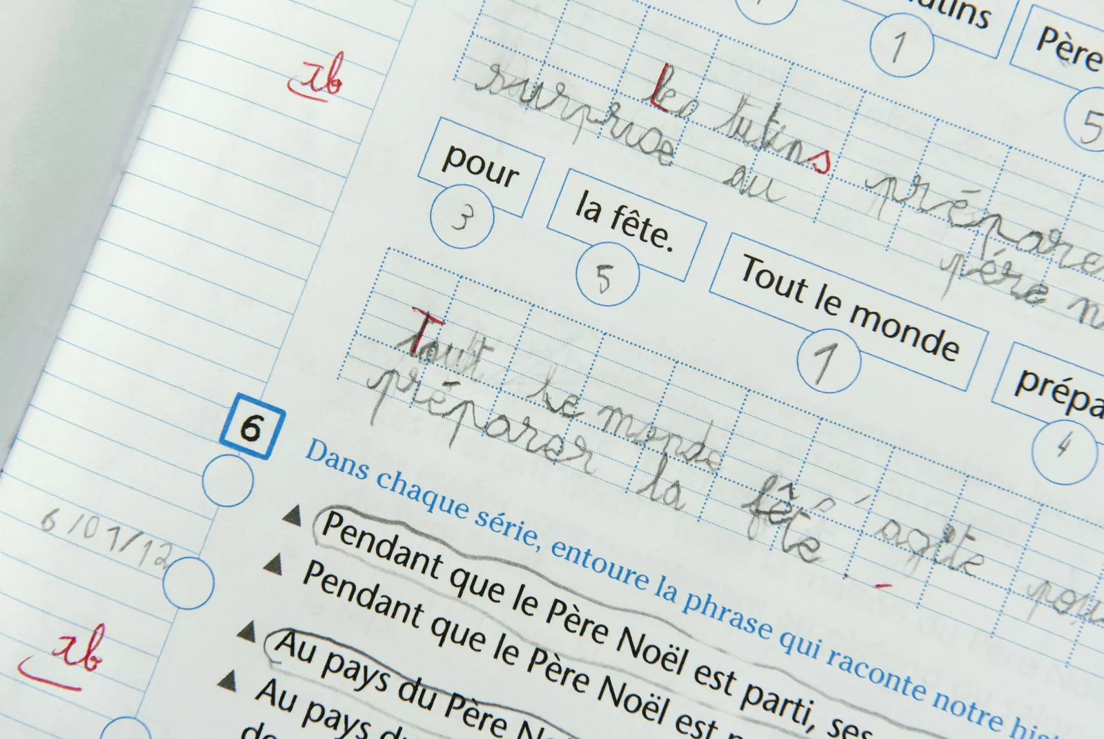 A Pearson Edexcel exam booklet and audio equipment on a desk