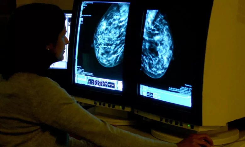 Laboratory technician analysing a tumour tissue sample for genomic testing