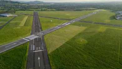 Aerial view of Gloucestershire Airport's runways and business parks near Staverton.