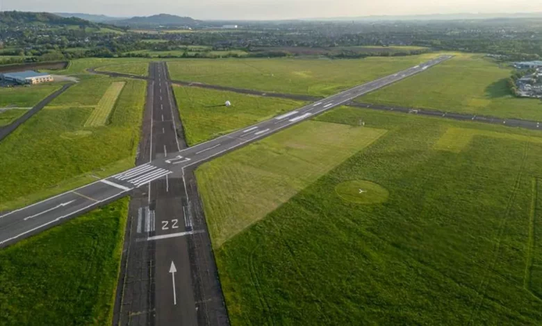 Aerial view of Gloucestershire Airport's runways and business parks near Staverton.