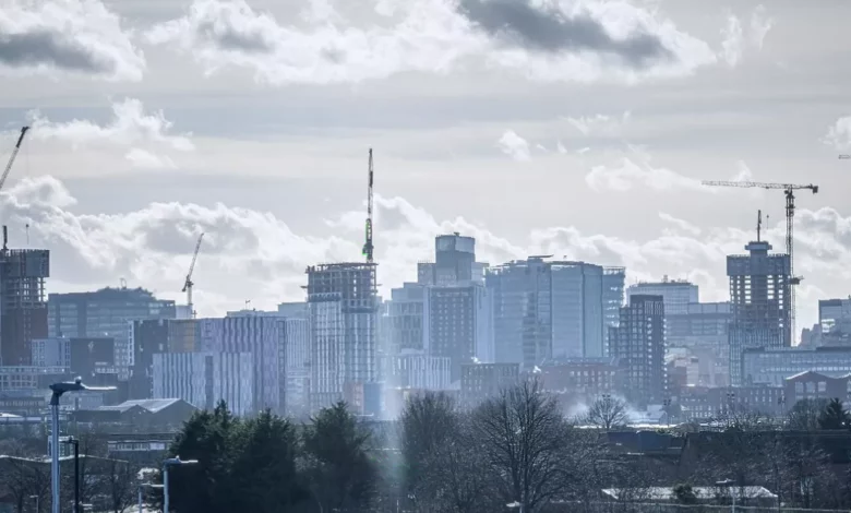 Aerial view of Birmingham city centre with modern office towers and construction cranes