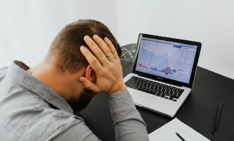 Senior UK marketers reviewing campaign performance data on a digital dashboard