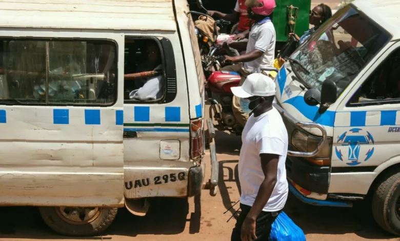 Healthcare workers in protective suits at a Ugandan treatment centre