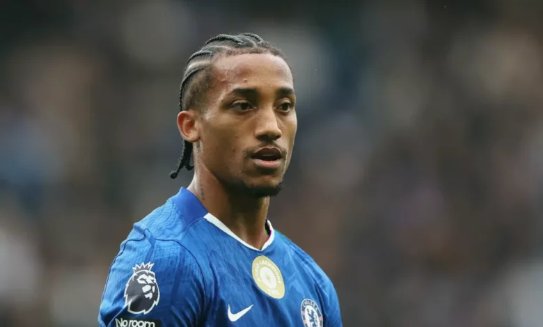 Chelsea forward Joao Pedro holds off a defender during a Premier League match at Stamford Bridge
