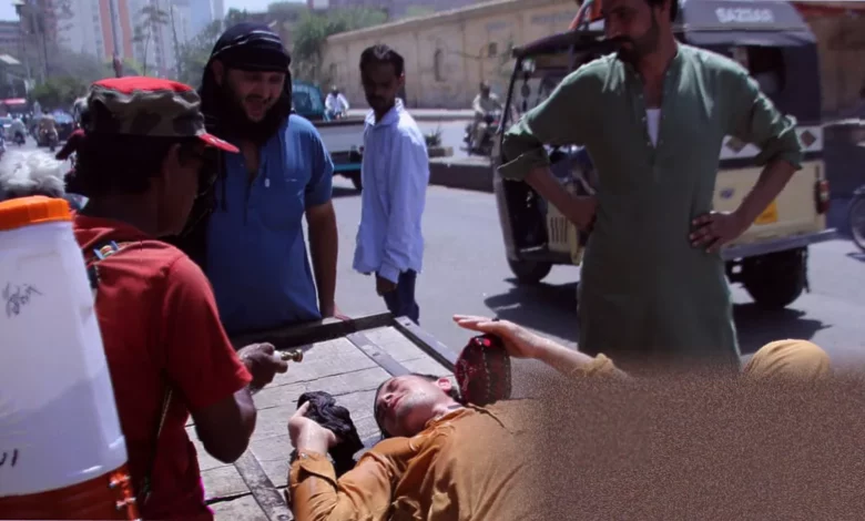 Fishermen in Ibrahim Hyderi boatyard work under intense sunlight during Karachi heatwave