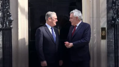 Labour leader Keir Starmer standing alongside former PM Gordon Brown at a political event