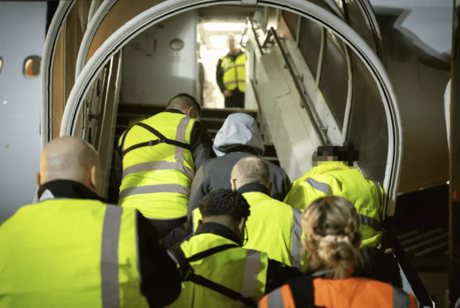 A Home Office deportation flight preparing for takeoff at a UK airport.