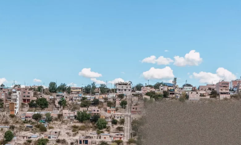 Steep hillside shanty town with precarious houses and unpaved roads in Ayacucho, Peru