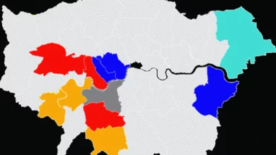 Election results board displaying council seat counts for London boroughs