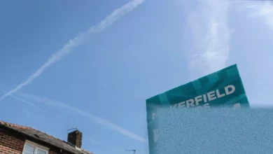 Turquoise Reform UK banners lining roads in the Makerfield constituency