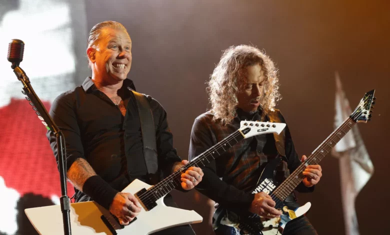 Crowd of concertgoers at a Metallica stadium concert in the UK