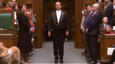 Black Rod knocks three times on the closed doors of the House of Commons chamber