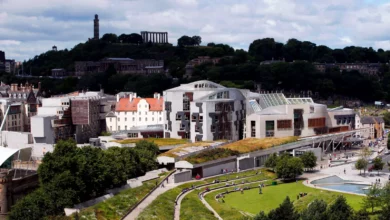 Scottish Parliament chamber during a debate with MSPs seated in an elliptical arrangement