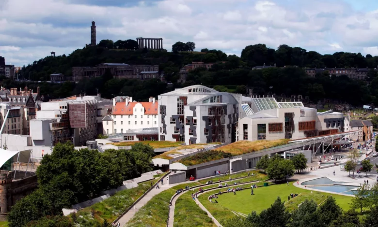 Scottish Parliament chamber during a debate with MSPs seated in an elliptical arrangement