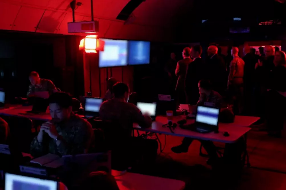 NATO personnel operating a subterranean headquarters with AI-powered battlefield management systems