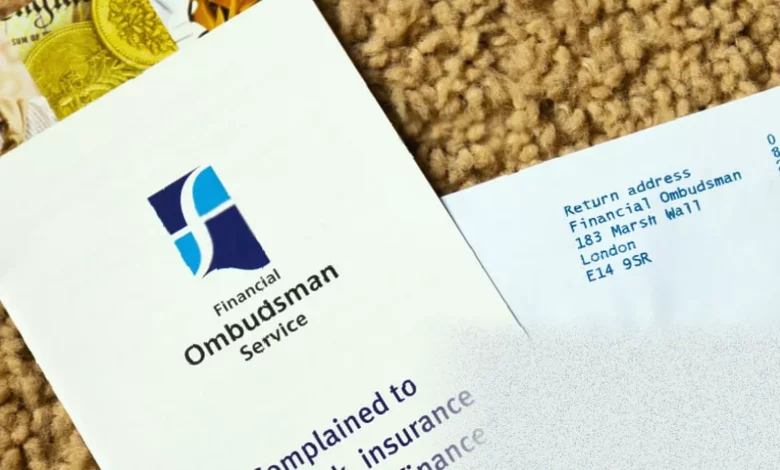 A document titled "Enhancing Financial Services Bill" sits on a wooden desk in a government building
