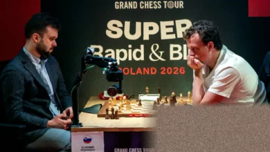 Chess grandmaster Hans Niemann playing at a board in Warsaw tournament