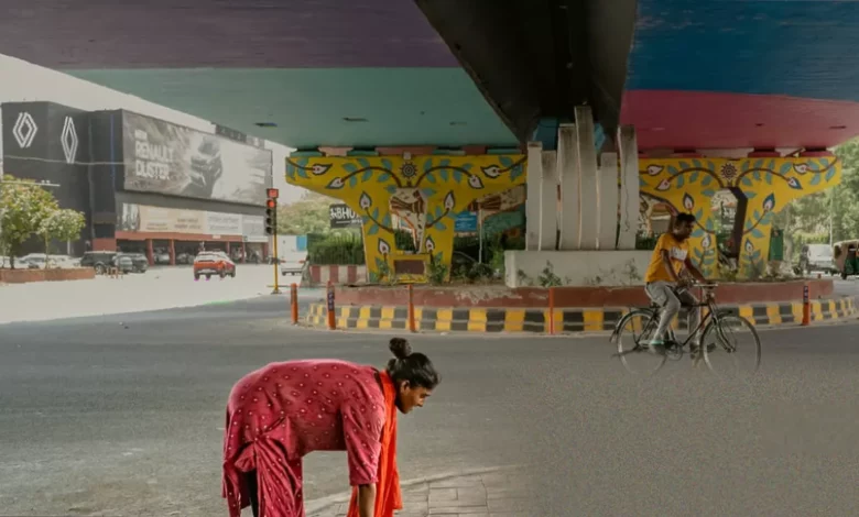 Family sleeping on thin mats under a concrete flyover in Delhi during a heatwave