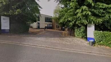 Aerial view of Henley College campus with students walking between buildings