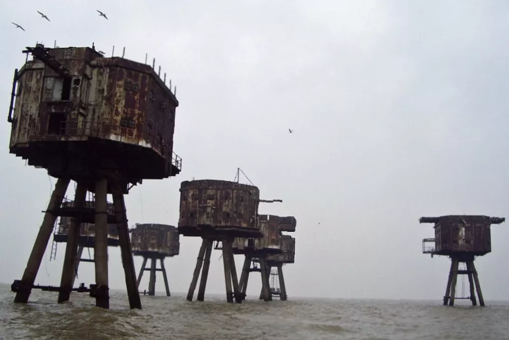 Maunsell sea forts standing rusted in the Thames Estuary from a distance